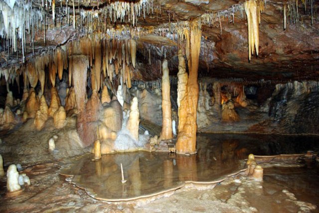 image 17-assorted-speleothems-in-a-reflective-rim-pool-jpg