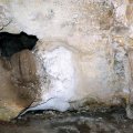 image 34-speleothem-growing-out-of-a-hole-in-cave-wall-jpg
