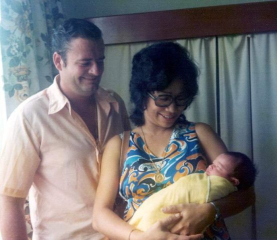 image 055-1973-sep-17-holding-baby-deej-at-gleneagles-hospital-singapore-jpg