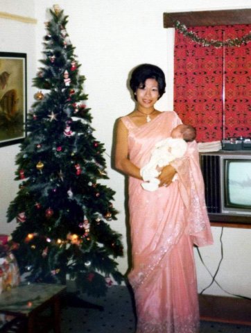 image 057-1975-holding-baby-sharon-at-christmas-toh-avenue-singapore-jpg