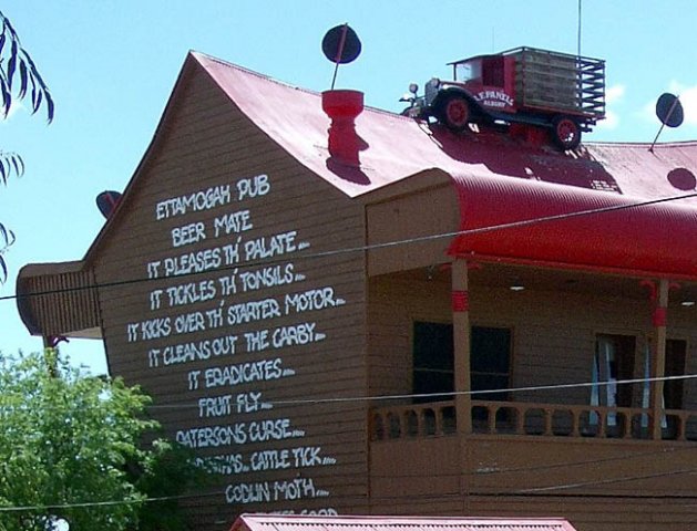 image ettamogah-pub-writing-on-right-side-of-pub-with-a-truck-on-the-roof-jpg