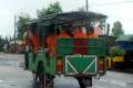 096-Novice-Buddhist-monks-getting-free-tuk-tuk-ride-in-the-rain-on-the-National-Highway-4-to-Phnom-Penh