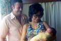 055-1973-Sep-17-Holding-baby-Deej-at-Gleneagles-Hospital-Singapore